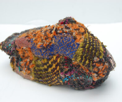 "Humble Ruthenium II" by Deborah Kuster (c) - 4"h x 8"w x 4"d - handwoven textiles, styrofoam, embroidery thread