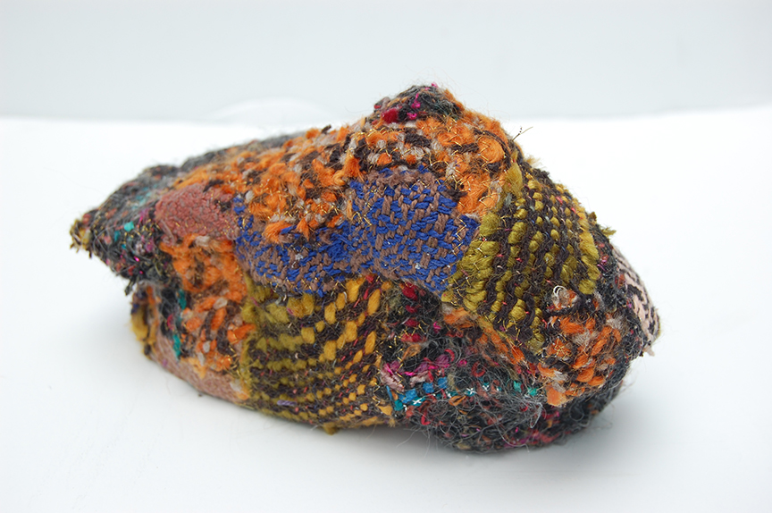 "Humble Ruthenium II" by Deborah Kuster (c) - 4"h x 8"w x 4"d - handwoven textiles, styrofoam, embroidery thread