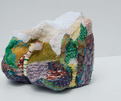 "Lifted Lithium III" by Deborah Kuster (c) - 8"h x 9"w x 10"d - handwoven textiles, styrofoam, embroidery thread