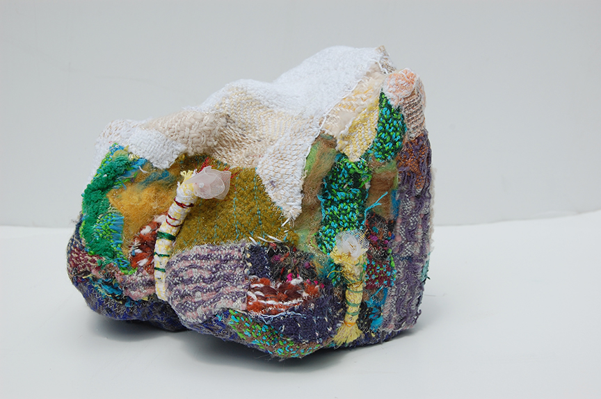 "Lifted Lithium III" by Deborah Kuster (c) - 8"h x 9"w x 10"d - handwoven textiles, styrofoam, embroidery thread