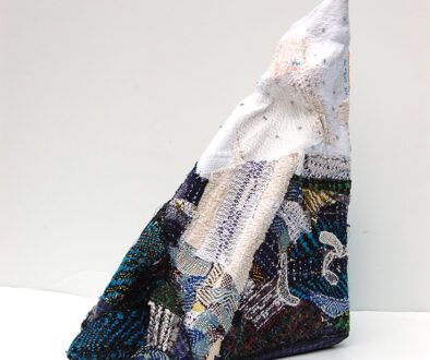 "Lifted Lithium" by Deborah Kuster (c) - 19"h x 17"w x 9"d - handwoven textiles, styrofoam, embroidery thread