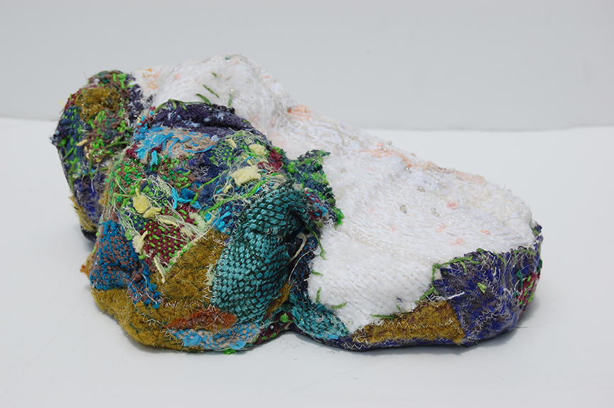 "Lifted Lithium II" by Deborah Kuster (c) - 4"h x 10"w x 7"d - handwoven textiles, styrofoam, embroidery thread